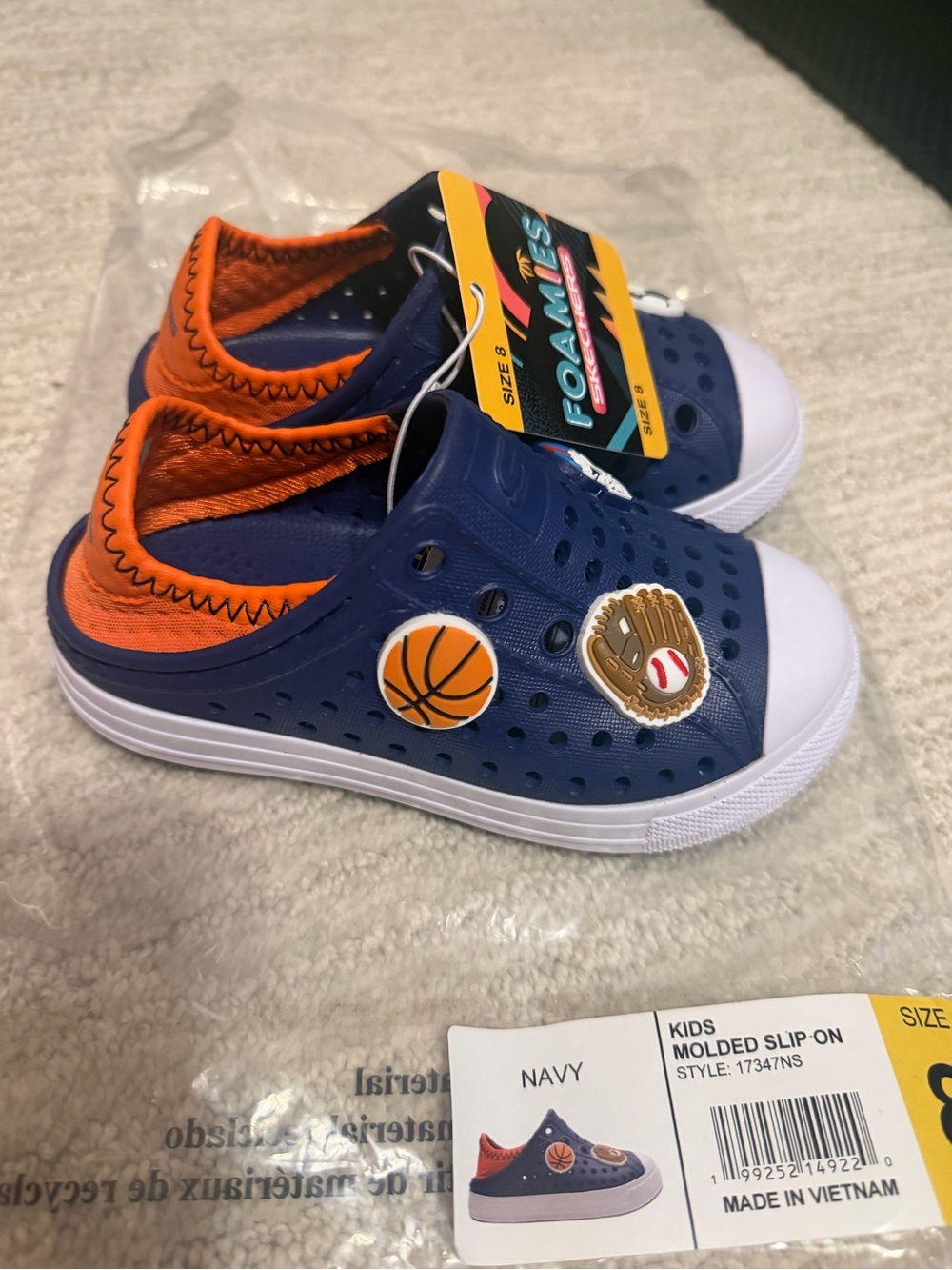 Skechers Kids Navy and Orange Foam Slip-On Shoes with Sports Charms